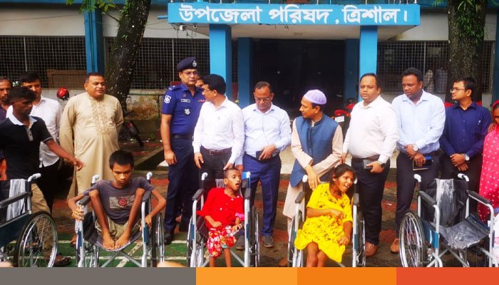 ত্রিশালে হুইল চেয়ার বিতরণ ও সামাজিক নিরাপত্তা বিষয়ক সেমিনার